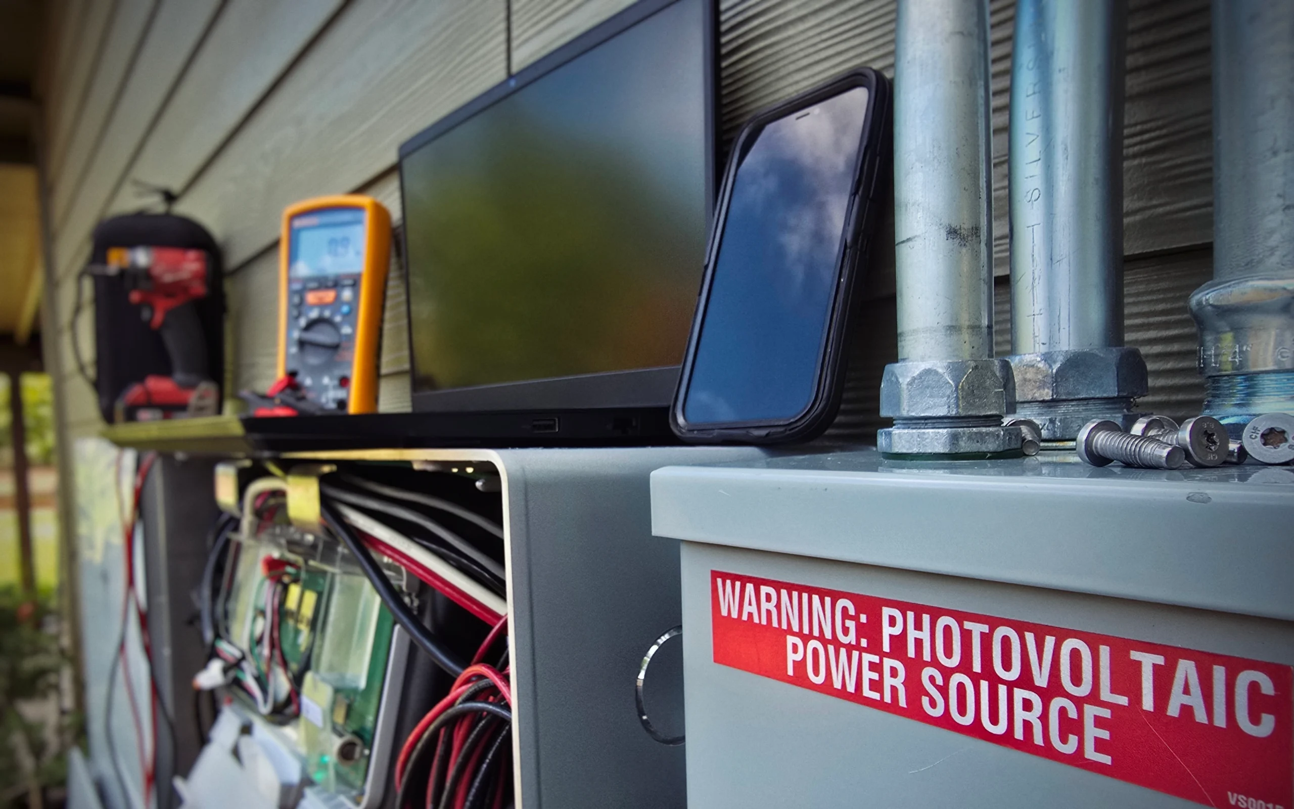 Solar and battery diagnostic tools on a workbench
