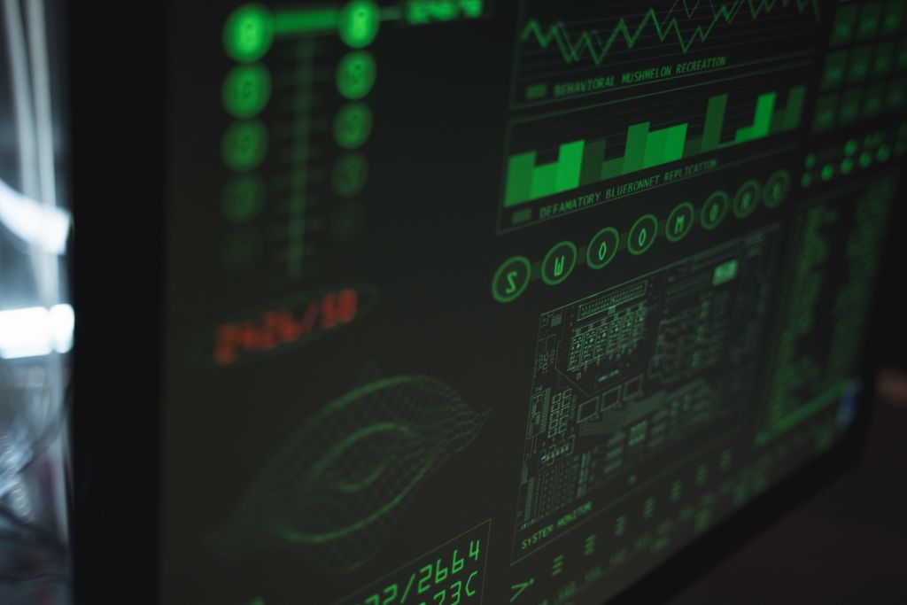 Monitoring 1 Close-up view of a computer displaying cybersecurity and data protection interfaces in green tones.